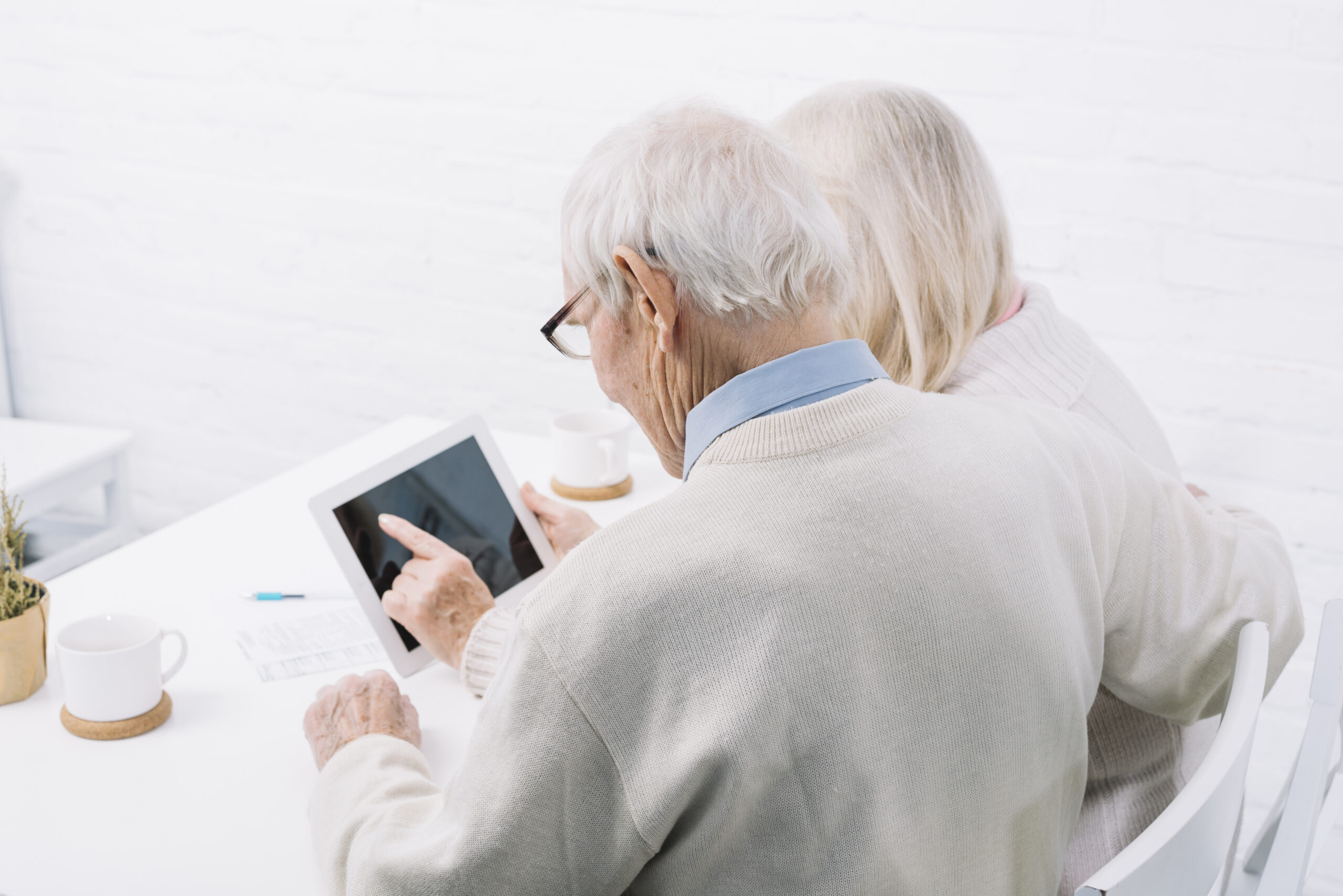 senior couple using tablet